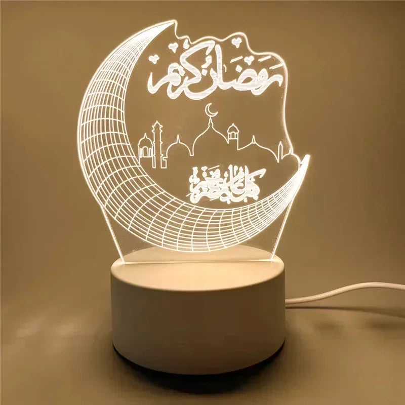A white acrylic LED night light shaped like a crescent moon with Arabic calligraphy and mosque silhouettes.