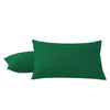 A pair of dark emerald green microfiber pillowcases with envelope closure.