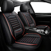 Black leather car seat covers with red stitching and accents shown in a vehicle interior.