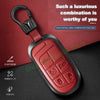 A red leather and metal car key case featuring multiple key cutouts for Jeep models.