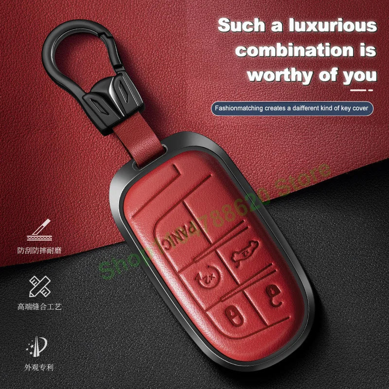 A red leather and metal car key case featuring multiple key cutouts for Jeep models.