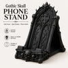 A black gothic skull phone stand featuring intricate thorn details.
