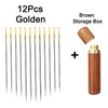 A set of 12 gold self-threading sewing needles and a brown storage box.