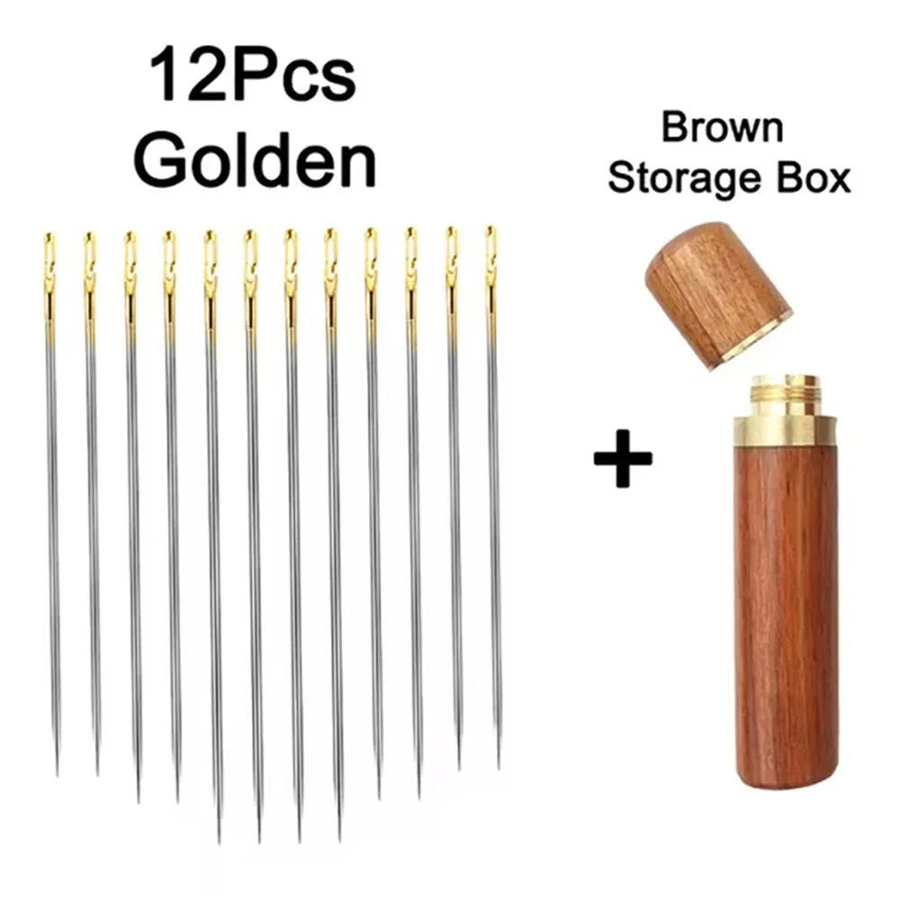 A set of 12 gold self-threading sewing needles and a brown storage box.
