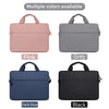 A set of four waterproof nylon laptop sleeves in pink, grey, dark blue, and black with carrying handles.