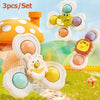 A set of three spinning bath toys featuring yellow and purple animals on a grassy background.