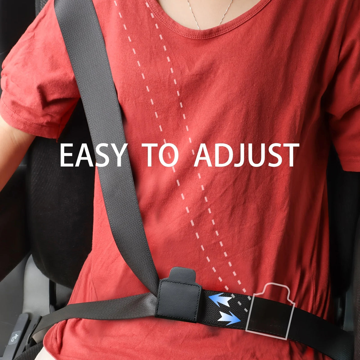 A person wearing a red shirt is shown with a black seat belt adjuster clip visible on their clothing.