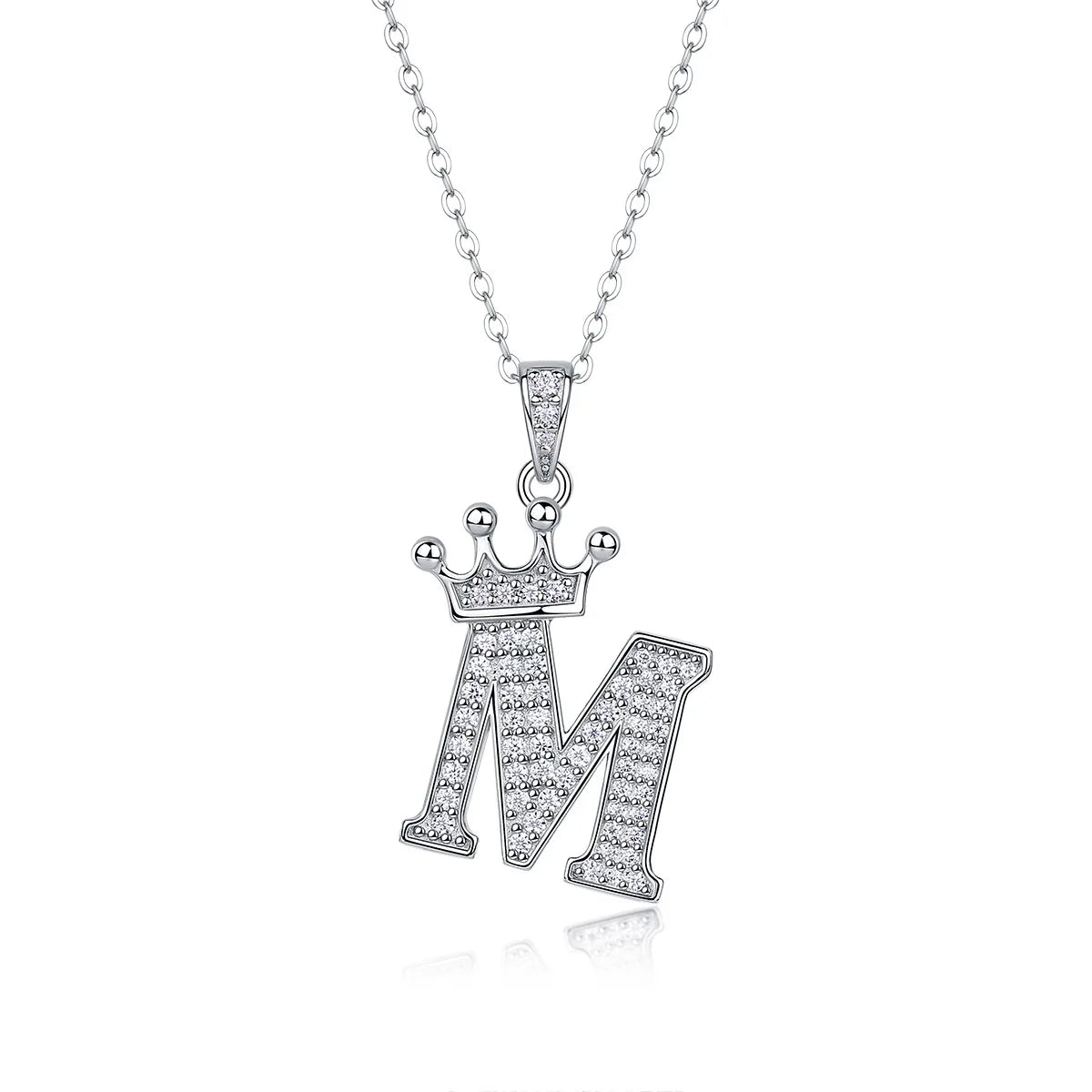 A sterling silver moissanite letter M pendant necklace with a delicate chain.