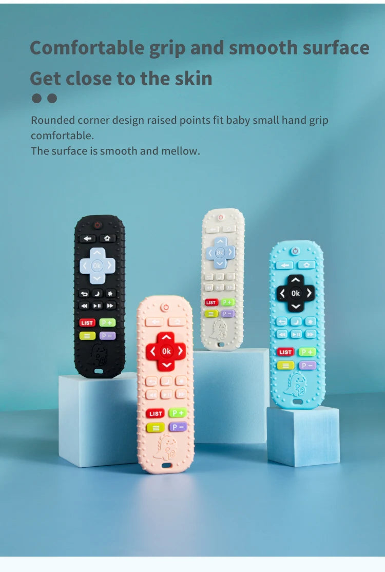 Three silicone baby teether toys in black, white, and blue with remote control shapes displayed on light blue cubes.