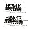 Black rustic iron wall hooks shaped like the words HOME SWEET HOME for home organization