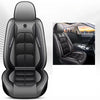 A black universal car seat cover with stitched design shown in a studio setting and inside a vehicle.