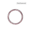 Pink diamond ring with a round band and pave-set stones.