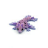A set of six articulated mini dragons in purple and lavender for Easter and decor.