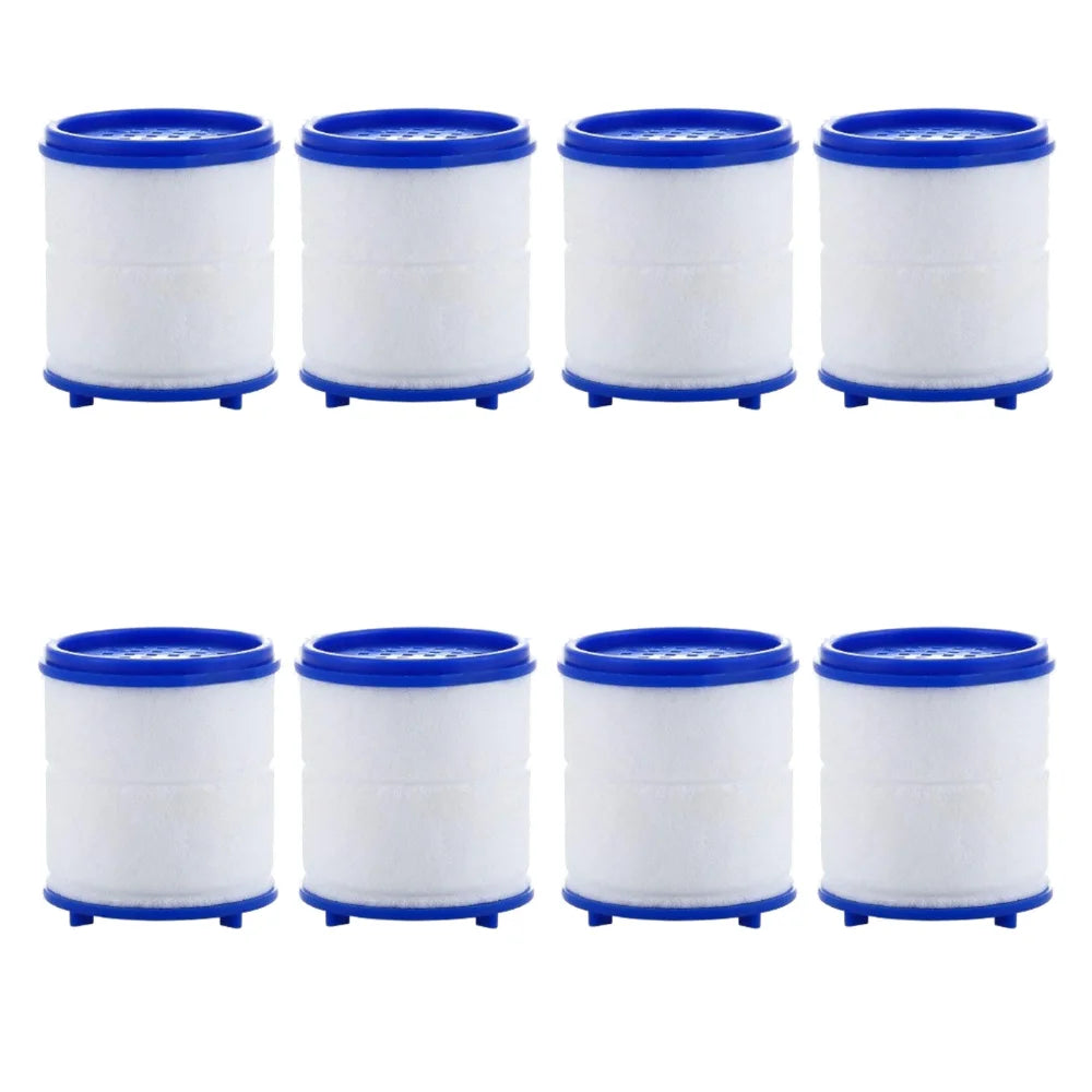 Four white cylindrical filters with blue caps and bases for a faucet water purifier