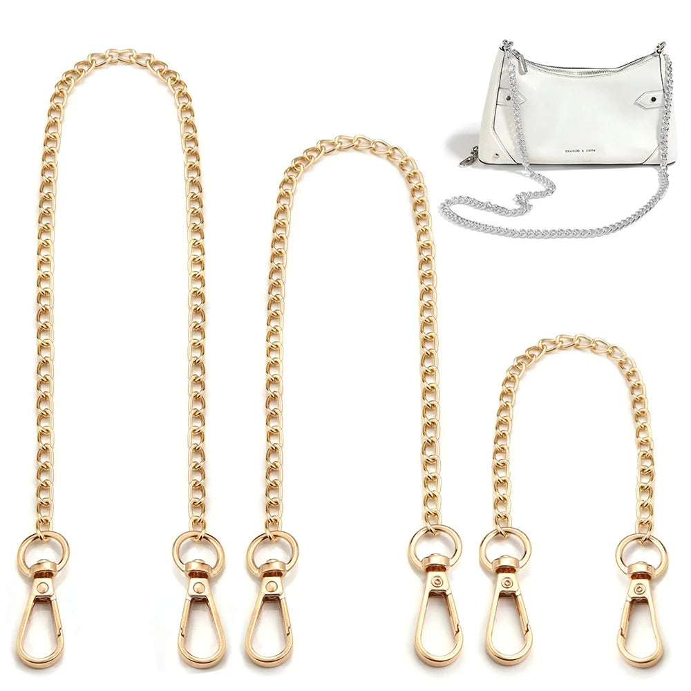 Gold metal chain strap for a bag and purse shown alongside a small white leather pouch