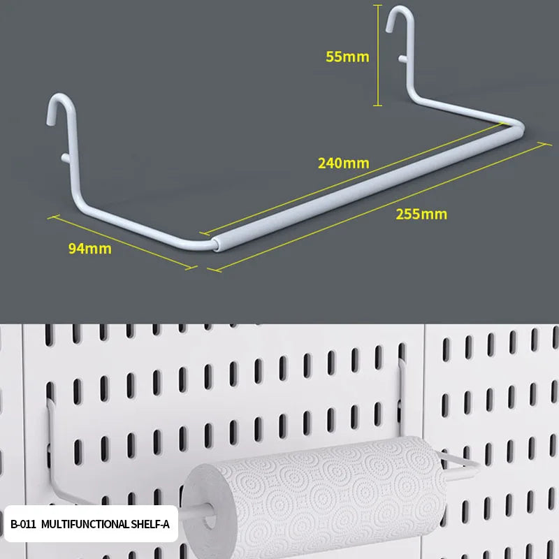 A white desktop pegboard organizer with a horizontal bar, hooks, and shelves mounted on a white panel.