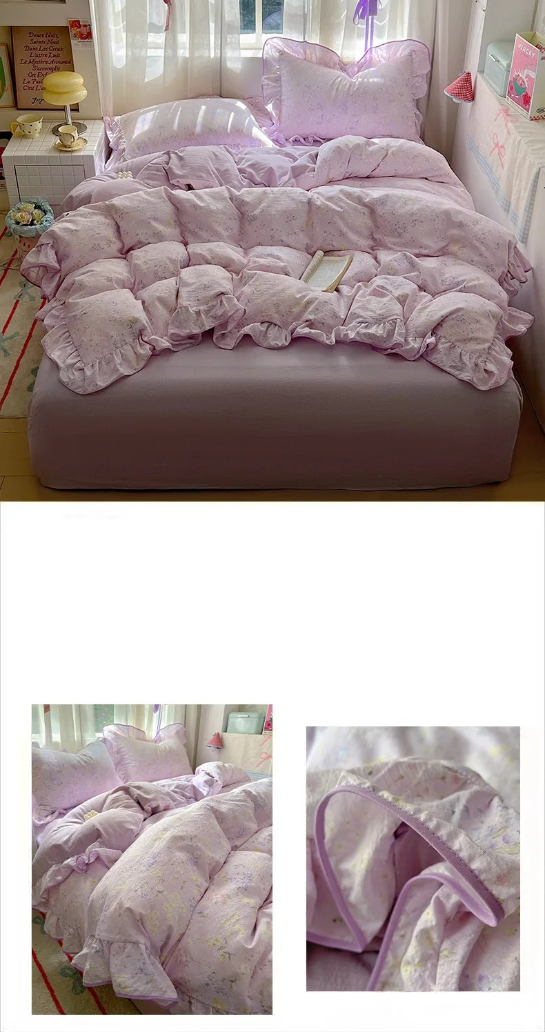 A set of floral pink duvet cover, pillowcases, and a flat sheet displayed on a bed.