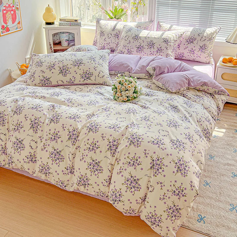 A floral duvet cover set featuring lavender and white floral patterns on a bed with matching pillows.