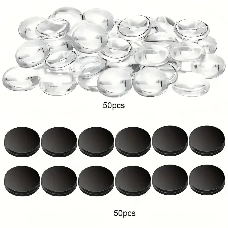 A collection of 50 clear glass dome cabochons and 50 black magnets for making a kit.