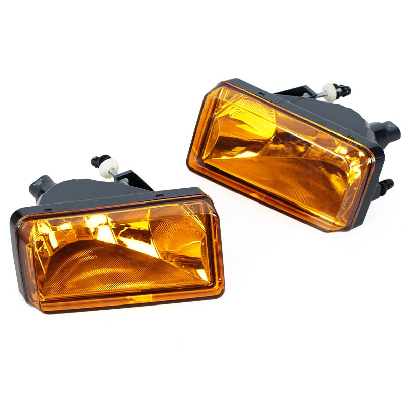 An orange direct-fit fog light assembly for a Chevy Silverado, Tahoe, Suburban, or Avalanche.