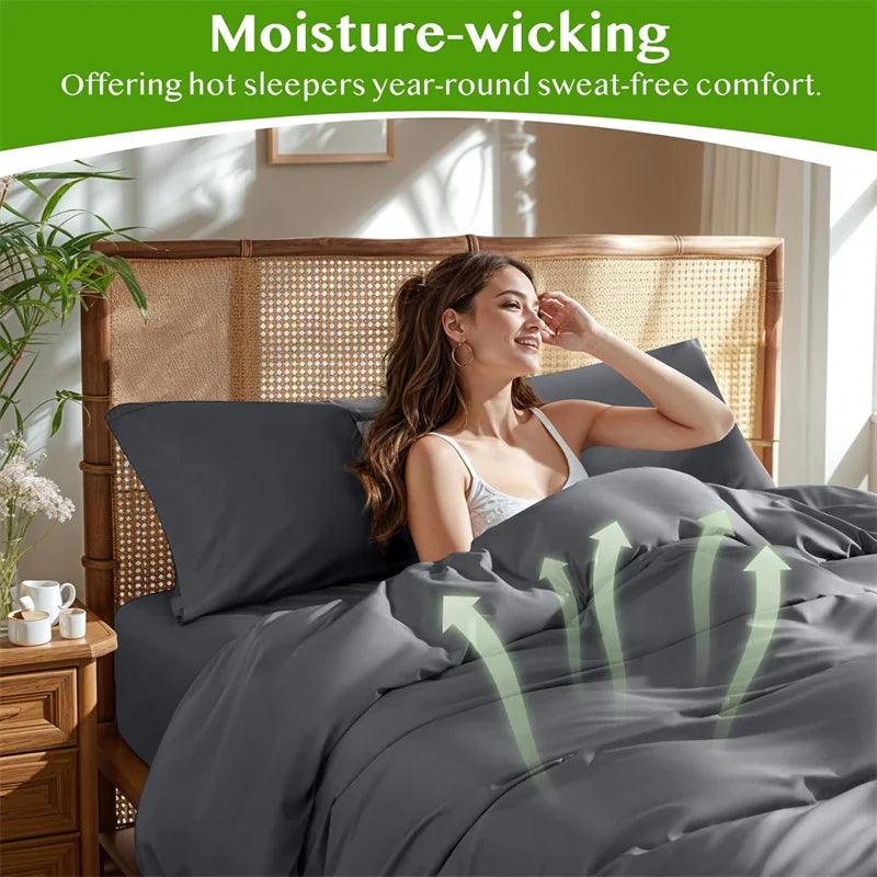 Eine Frau entspannt sich in einem Bett mit Bamboo-Duvetcover, das feuchtigkeitsableitendes Komfort demonstriert.