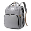 A gray large capacity diaper bag backpack with a zippered front pocket and a padded changing mat.