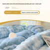 A close-up of a light blue fluffy fleece duvet cover with a rabbit pattern on a bed.