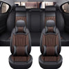 Black and brown full coverage PU leather car seat covers shown in the interior of a vehicle.