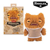 A fluffy orange Fuggler Ugly Monster plush toy with funny teeth and a mesh top.