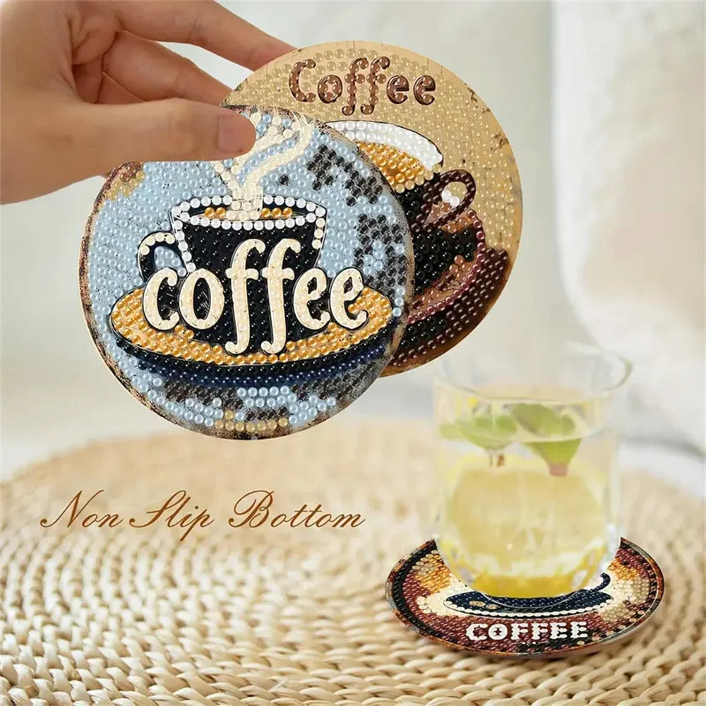 A hand holds a round diamond painting coaster featuring a coffee cup design, resting on a woven mat.