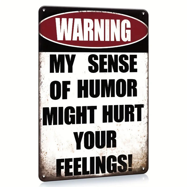 A rectangular metal tin sign with a warning label that reads My Sense of Humor Might Hurt Your Feelings