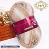 A ball of gradient dyed wool blend yarn with pink and beige tones, packaged for knitting.