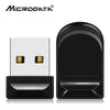 A black compact USB flash drive with a silver connector is shown next to its packaging.
