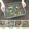 Stainless steel garden soil sieve showing roots, stones, leaves, and lumps of soil.