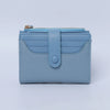 A light blue bi-fold wallet made of textured PU leather with a silver zipper and a flap closure.