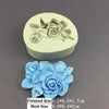 A light blue silicone mold shaped like a rose flower, shown next to the finished flower.