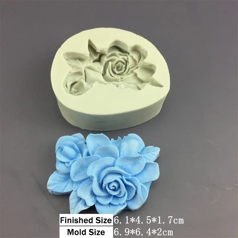 A light blue silicone mold shaped like a rose flower, shown next to the finished flower.