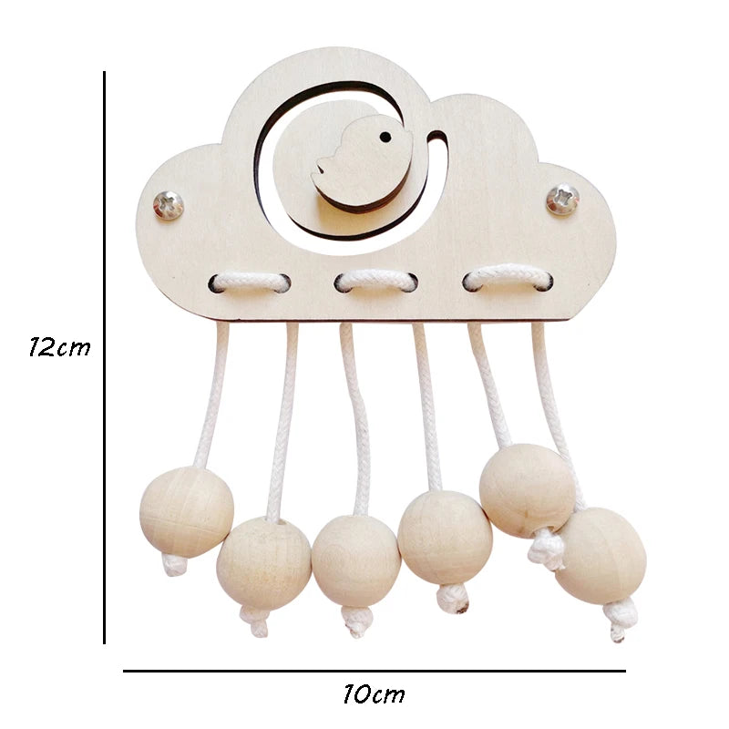 A wooden cloud shaped Montessori busy board with hanging round wooden beads for toddlers