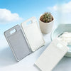 White compact anti-slip hand washing board with a small cactus plant in the background