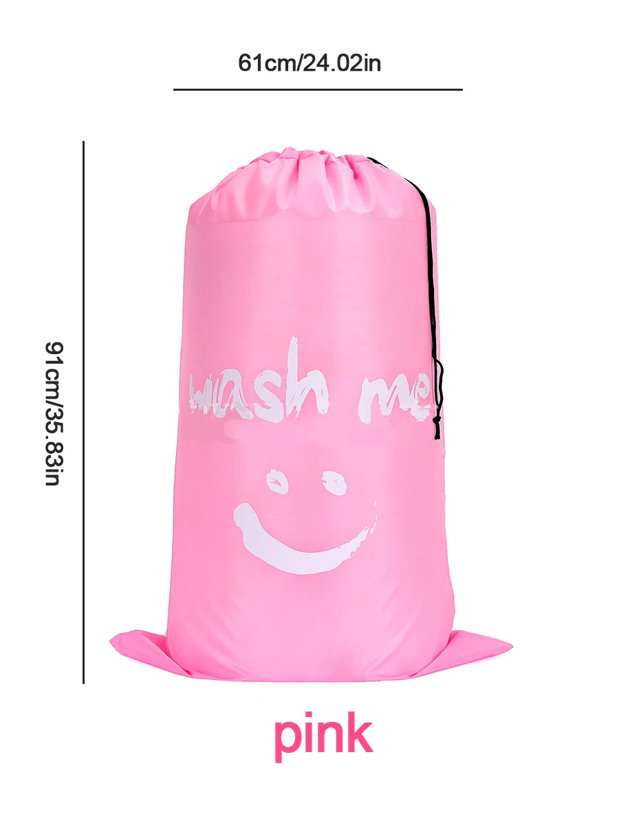 A pink drawstring laundry bag with the text 'wash me' printed on it.