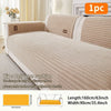 A beige non-slip minimalist sofa cushion cover with ribbed texture shown on a white sofa.