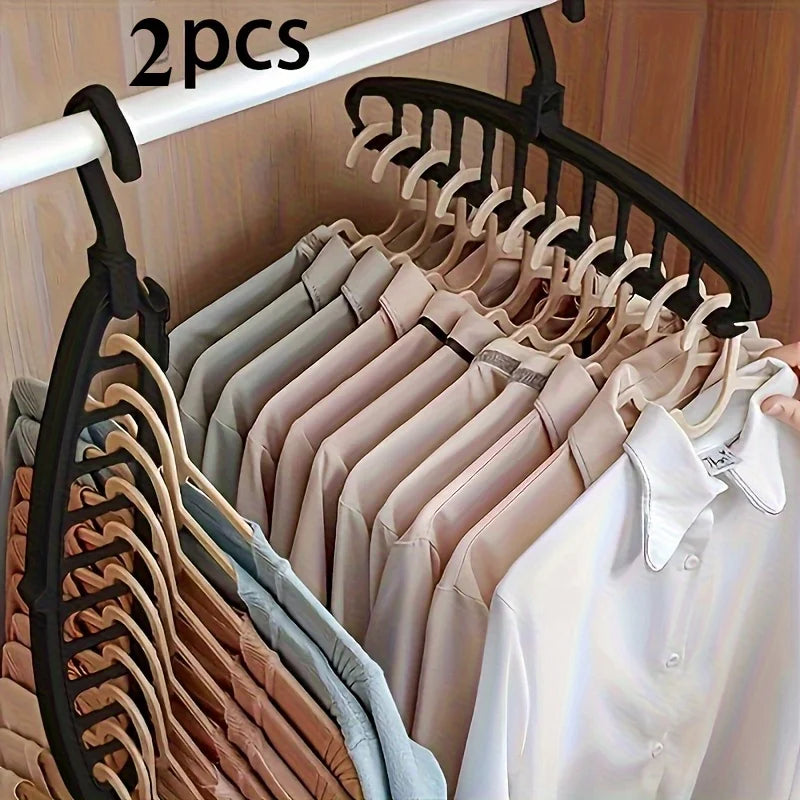 A display of multi-layer space-saving closet organizer hangers in various neutral tones like beige, pink, and white.