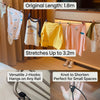 A retractable travel clothesline is shown with various colored shirts hanging on a rail, demonstrating its stretch and versat