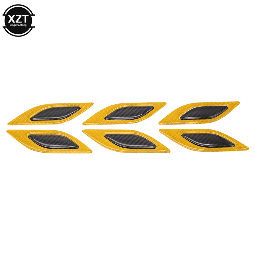 A set of six yellow reflective carbon fiber car styling strips.