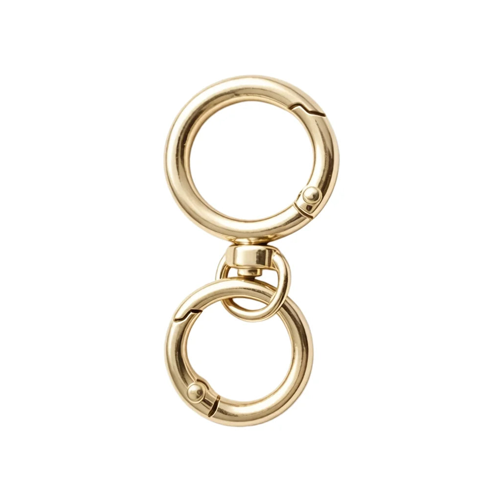 A round gold spring snap hook carabiner with a swivel design made of zinc alloy.