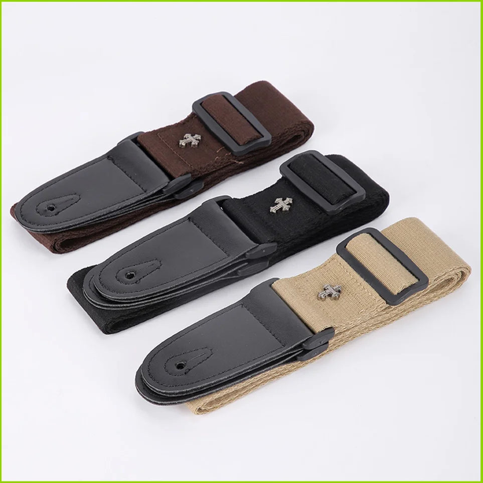 A vintage guitar strap in brown and black leather with a cross pattern and a pick pocket.