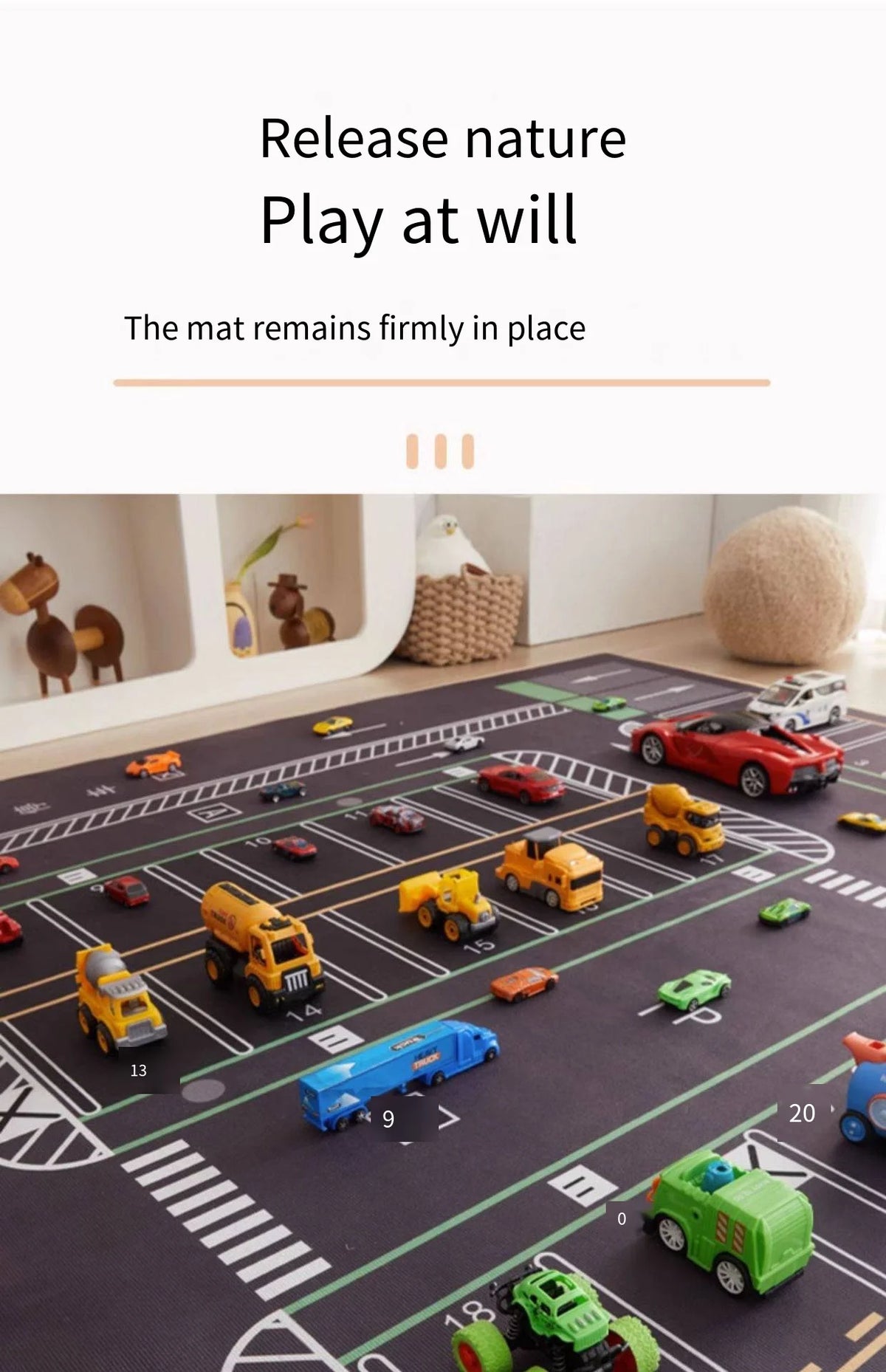 A dark play mat with various toy cars and vehicles laid out for a children's activity.