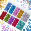 A clear plastic tray filled with various colors of shiny holographic star sequins for resin crafts
