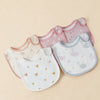 A set of pink and white cotton baby bibs with a U-shaped design featuring small heart and swan patterns.