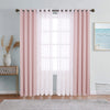 Pink dual layer window curtains featuring sheer and blackout fabric hanging in a window.